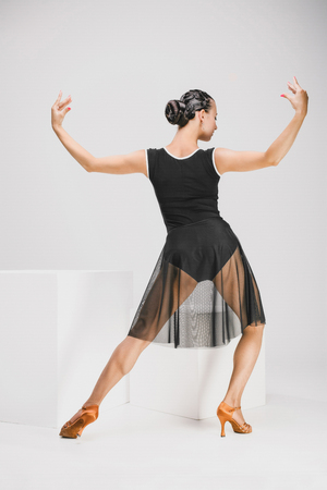 girl in black and transparent dress turning backwardsの写真素材