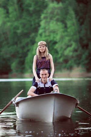 couple floating on the boatの写真素材