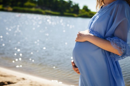 pregnant girl on the beachの写真素材