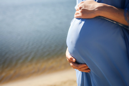 pregnant woman on the beachの写真素材