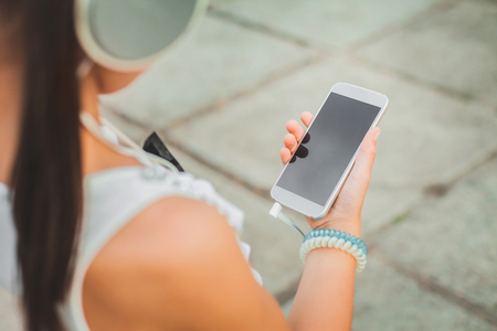 pretty girl with white phoneの写真素材