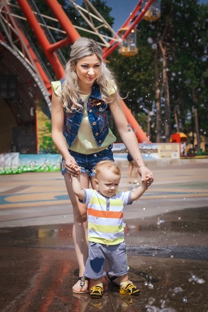 young mother walks with her sonの写真素材