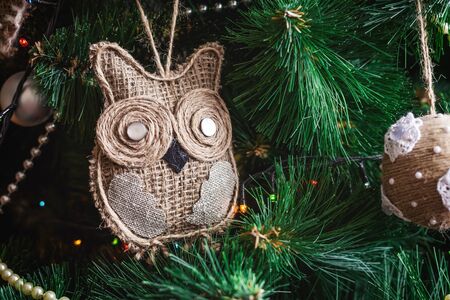close up Christmas tree and toy background and xmas decorations with toys, sparking, glowing. Happy...
