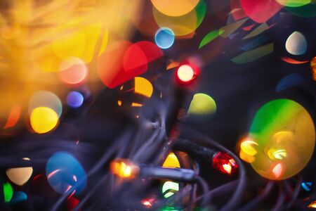 beauty garland with yellow red blurred lights glitter vintage lights background.