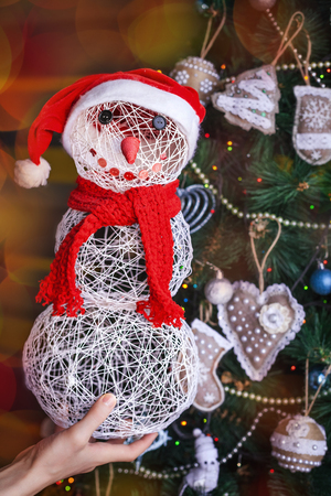 close up Christmas snowman and tree background and xmas decorations with toys, sparking, glowing. Happy New Year and Xmas theme. handmade decorの写真素材