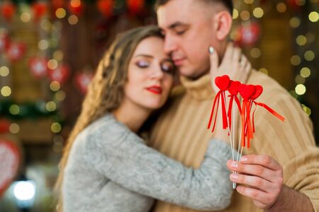 young boy and girl celebrate valentines day. they hugging and looking at each other. Concept of happy valentines dayの写真素材