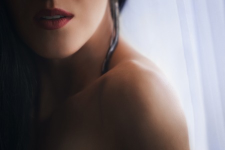 Fashion sexy womans body parts in boudoir room near the window. Close up portrait of sensual...