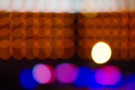 blurred blue and pink lights of the hotel at night. boke circles . free space for advertising text