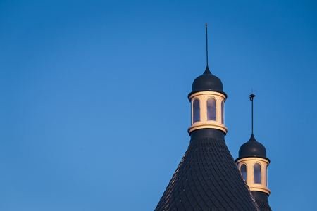very top of the medieval old stunning castle, with blue roof ,spire, and great amount of windowsの写真素材