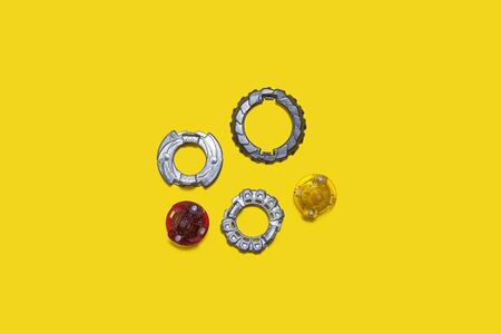 set of popular kid boys toys over yellow background. rings of differend shapes and colours