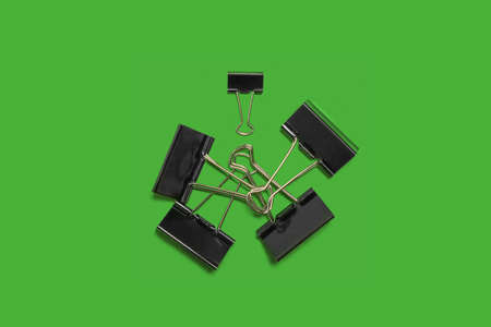 paper clips on a green surface. school and officeの写真素材