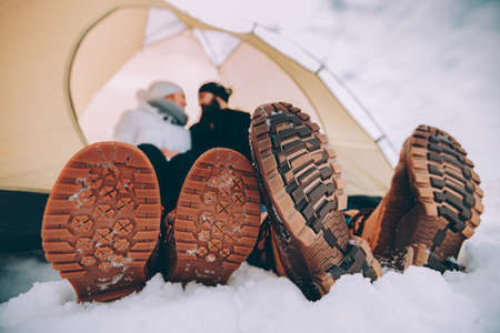 close up male and female winter shoes.の写真素材