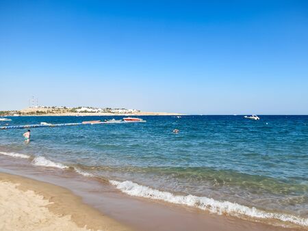 Sea shore, horizon, island in the distance and blue sky. Holidays in the Red Seaの写真素材