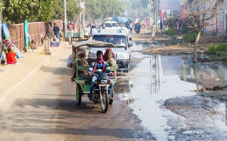 Transport and people on the roads of India. India, Vrindavan, November 2016のeditorial素材