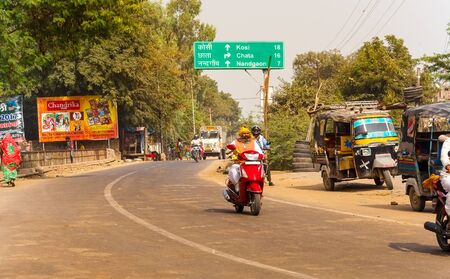 Transport and people on the roads of India. India, Vrindavan, November 2016のeditorial素材