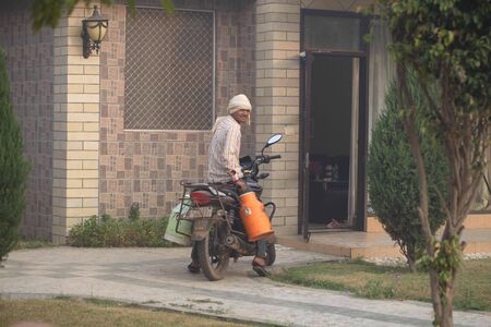 Transport and people on the roads of India. India, Vrindavan, November 2016のeditorial素材