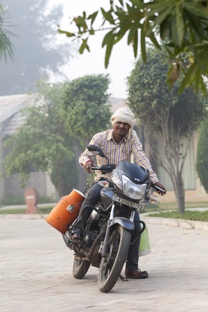 Transport and people on the roads of India. India, Vrindavan, November 2016のeditorial素材