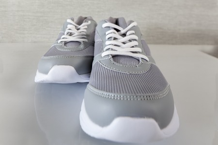 gray sneakers with lacesの写真素材
