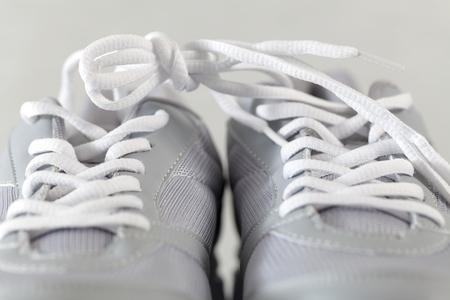 gray sneakers with lacesの写真素材
