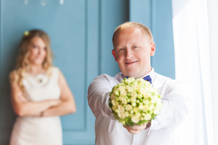 Happy newlyweds near bride and groomの写真素材