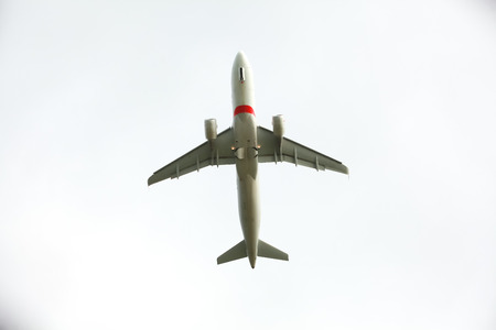 passenger plane takes off into the skyの写真素材