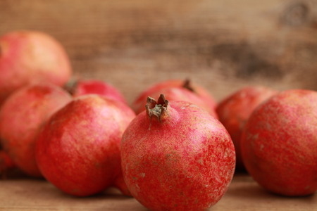 pomegranates on a wooden counterの写真素材