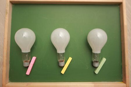 bulb on a school boardの写真素材