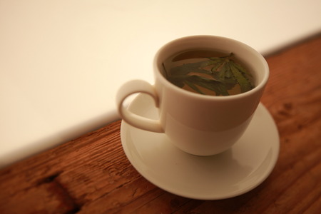 cannabis tea white cupの写真素材