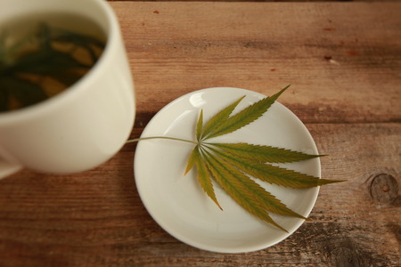 cannabis tea white cupの写真素材