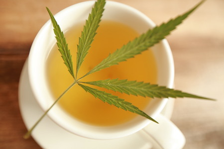 cannabis tea white cupの写真素材