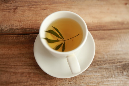 cannabis tea white cupの写真素材