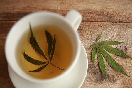 cannabis tea white cupの写真素材