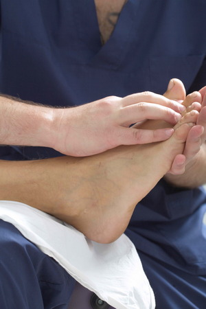 massage therapist makes a man a massageの写真素材
