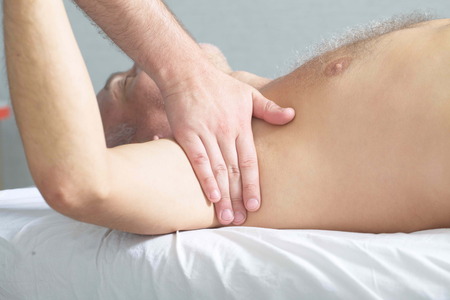 massage therapist makes a man a massageの写真素材