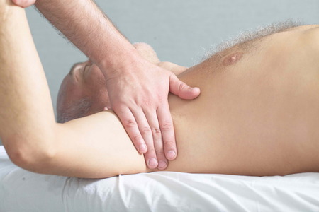 massage therapist makes a man a massageの写真素材