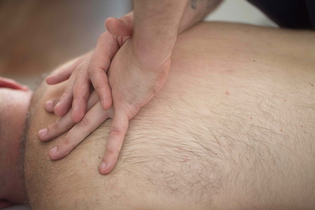 massage therapist makes a man a massageの写真素材