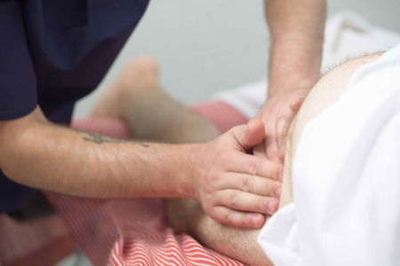 massage therapist makes a man a massageの写真素材