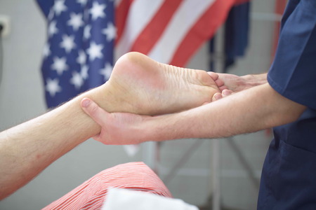 massage therapist makes a man a massage