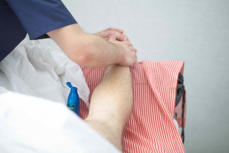 massage therapist makes a man a massageの写真素材