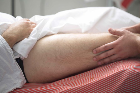 massage therapist makes a man a massage