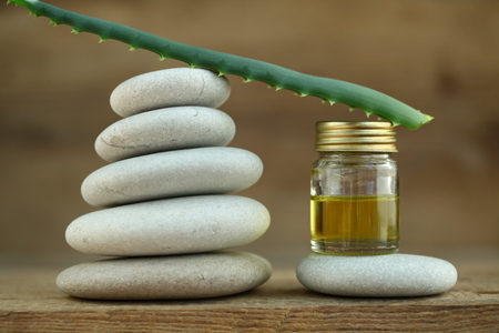 Aloe oil spa therapy wood backgroundの写真素材