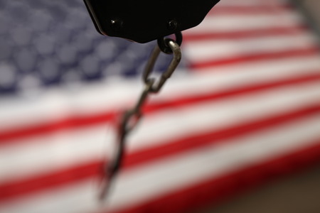 handcuffs on the background of the US flagの写真素材