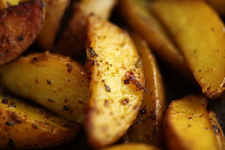 fried in ghee with spices pieces of potatoes