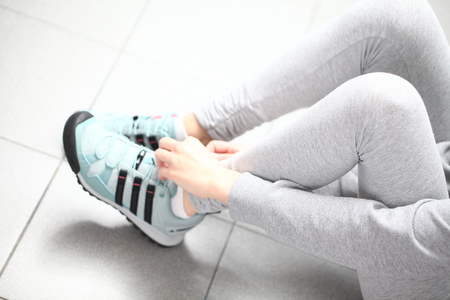Belarus, Minsk, March 18, 2012. The girl in sneakers Adidas terrex trainingのeditorial素材