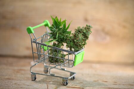 Marijuana medical cannabis cbd in mini shopping cart toyの写真素材