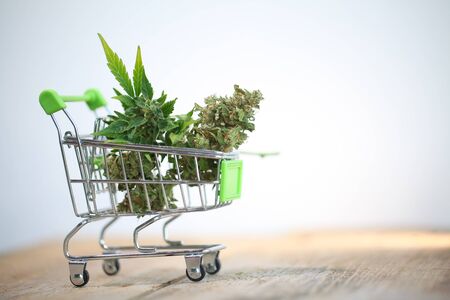 Marijuana medical cannabis cbd in mini shopping cart toyの写真素材