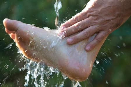 Muslim man washes his hands before prayer ritual cleansingの写真素材