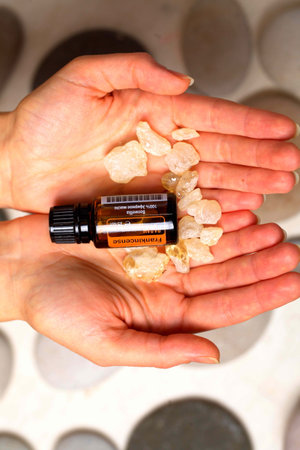 belarus, minsk, 2021. illustrative editorial doterra oil in hand womanのeditorial素材