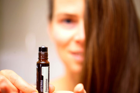 belarus, minsk, 2021. illustrative editorial doterra oil in hand womanのeditorial素材