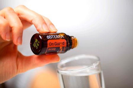 belarus, minsk, 2021. illustrative editorial doterra oil in hand woman